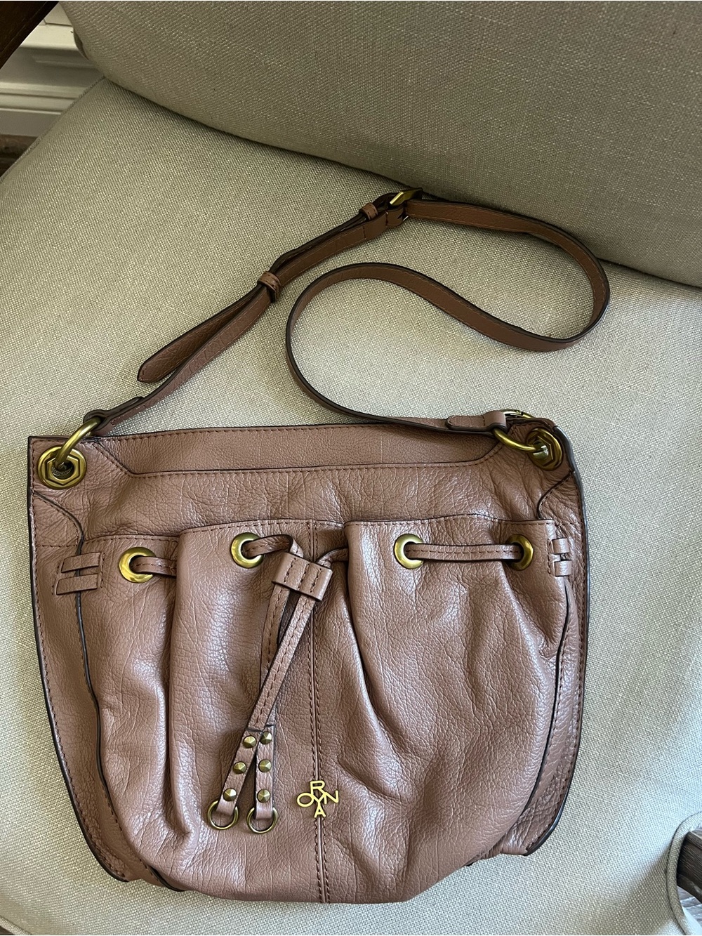 OrYany Taupe Leather Crossbody Drawstring Bag